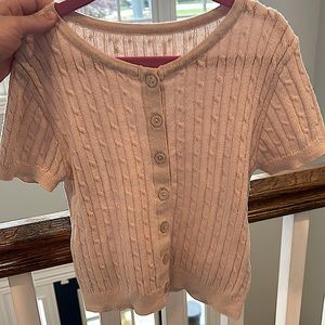 Pink button up shirt. Size XS, comes with extra button